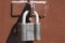 Large padlock on the iron gate. Reliable property protection