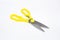 A large pair of scissors with yellow handles