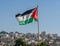 The large Palestinian flag is waiving above the city.