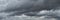 Large panorama of dramatic sky with dark storm clouds