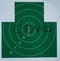 A large paper green target that says COVID. The holes in the center of the target