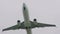 Large passenger airplane, airliner is flying in the gray sky: slow motion