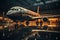 A large passenger airplane stands in an airport hangar