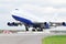 Large passenger airplane takes off at airport.