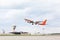 Large passenger airplane takes off at airport.