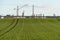 A large petrochemical enterprise on the background of a wheat field. Next to the agricultural field