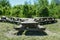 Large picnic table and bench in a sunny public park