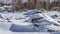 Large picturesque boulders lie in snowdrifts.