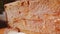 Large piece of honeycombs with golden honey on table closeup