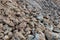 Large pieces of stone clay at the bottom of a mining quarry of minerals, background structure