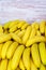 A large pile of appetizing looking yellow bananas in a container box, copy space
