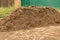 Large pile of manure. Fertilizer for garden plants. Chicken poop