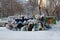 A large pile of plastic bags of garbage and household waste in the city dump in the winter in Novosibirsk pollutes the environment