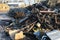 A large pile of scrap metal awaits processing, metal sorting