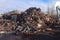 A large pile of scrap metal awaits processing, metal sorting