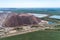 A large pile of unused rock, industrial storage of loose materials. Aerial view