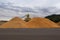 Large piles of sawdust at a wood processing plant