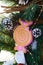 Large pink candy, fir branches, cones - festive decorations for the New Year, Christmas. Decoration interior courtyard, street.