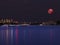 Large pink moon over the Patong beach skies of Sydney Australia