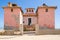 Large pink ruined mansion from Portuguese colonial times in Angola