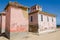 Large pink ruined mansion from Portuguese colonial times in Angola