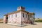 Large pink ruined mansion from Portuguese colonial times in Angola