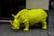 A large plastic rhino figure, a symbol of confidence and fearlessness