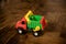 A large plastic toy truck isolated wooden background.Colorful toy truck for early education. Boys game.toy car. Transportation for