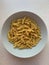 Large plate of dry noodles, plate of sedadini noodles, Italian durum noodles, uncooked dry noodles,