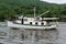 Large pleasure boat making it`s way down section of the Erie Canal, New York, 2018