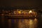 Large pleasure boat with people. Illumination and night walk. Tourism and recreation