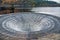 Large plughole at the Ladybower reservoir in overflow