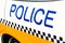 Large police sign on the side of a patrol vehicle.