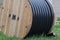 Large polyethylene pipes in the coil for gas and water are liyng on the ground.