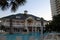 Large pool lined with lounge chairs in early morning sun, Beach Club Resort, Gulf Shores, Alabama, 2018