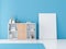 Large Poster canvas mockup on the floor in modern Room with blue wall and white wooden bookshelf