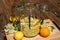 In the large preserving jar on the cutting board are the fresh elderflowers, oranges and lemon slices and the vanilla pod in the b