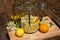 In the large preserving jar on the cutting board are the fresh elderflowers, oranges and lemon slices and the vanilla pod in the b