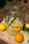 In the large preserving jar on the cutting board are the fresh elderflowers, oranges and lemon slices and the vanilla pod in the b