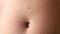 Large protruding mole wart on the man's stomach above the navel, closeup view.