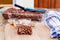 Large puffed wheat square treat with small glass bowls of raw ingredients beside