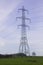 A large pylon and cables carrying electricity generated at Ballylumford Power Stationy into the grid