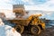 Large quarry dump truck. Loading the rock in dumper. Loading coal into body truck. Production useful minerals. Mining