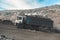 Large quarry dump truck. Loading the rock in dumper. Loading coal into body truck. Production useful minerals. Mining