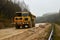 Large quarry dump truck. View of the large sand pit. Production useful minerals. Loading the rock.