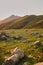 Large quartz rocks on a mountain meadow. sunset in the mountains. beautiful gony background