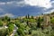 A large rain cloud looming over the city of San Quirico d \'Orcia