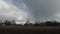 Large rain clouds in the sky over an abandoned village. Cloudy weather, time-lapse.