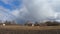 Large rain clouds in the sky over an abandoned village. Cloudy weather, time-lapse.