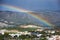 Large rainbow over city